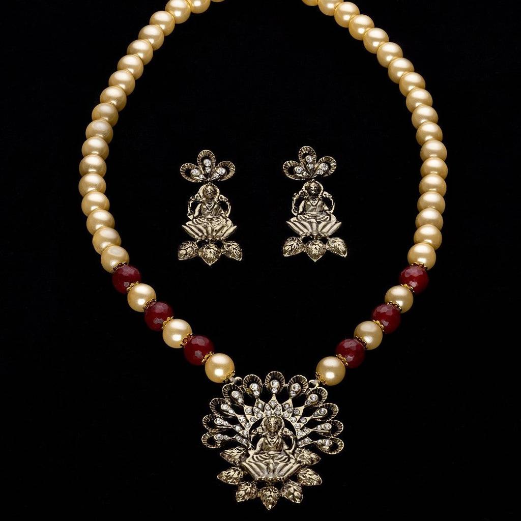 Estele Gold Plated Exquisite Laxmi Devi Pearl Necklace Set With Austrian Crystals & Red Beads For Women : 10011-IGNKER