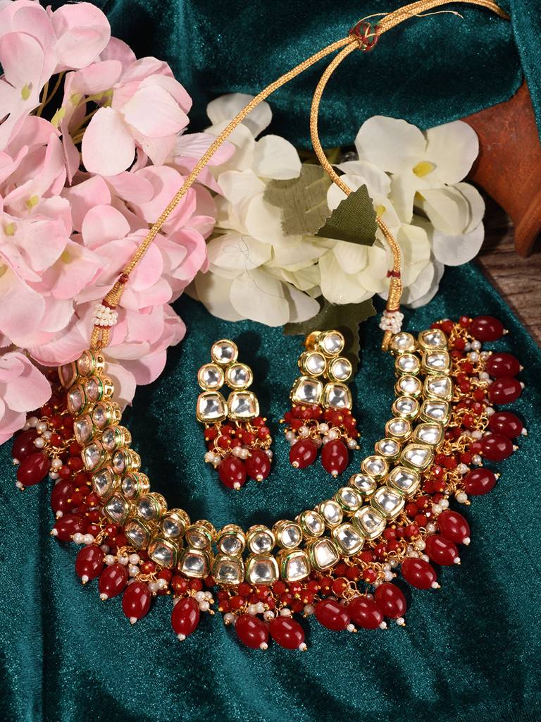 Gold Toned Kundan & Red Bead Studded Handcrafted Jewellery Set : SJNK1697