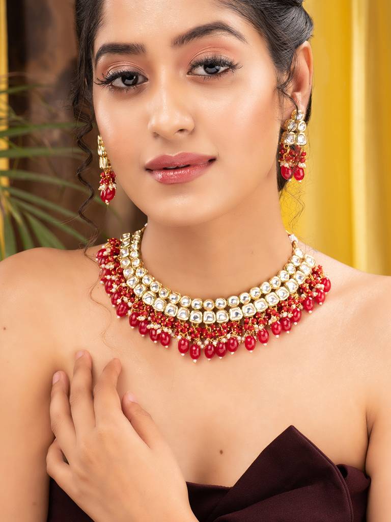 Gold Toned Kundan & Red Bead Studded Handcrafted Jewellery Set : SJNK1697