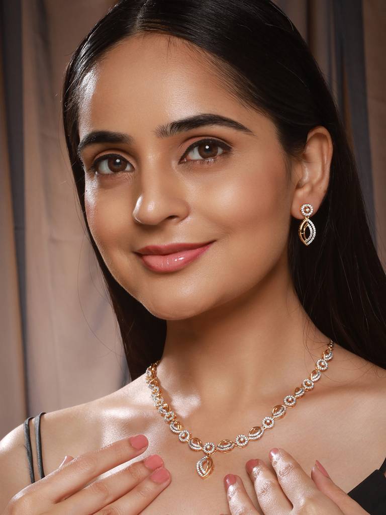 Gold Toned Ad Studded Minimal Leaf Design Pendant Jewellery Set : SJNK2572