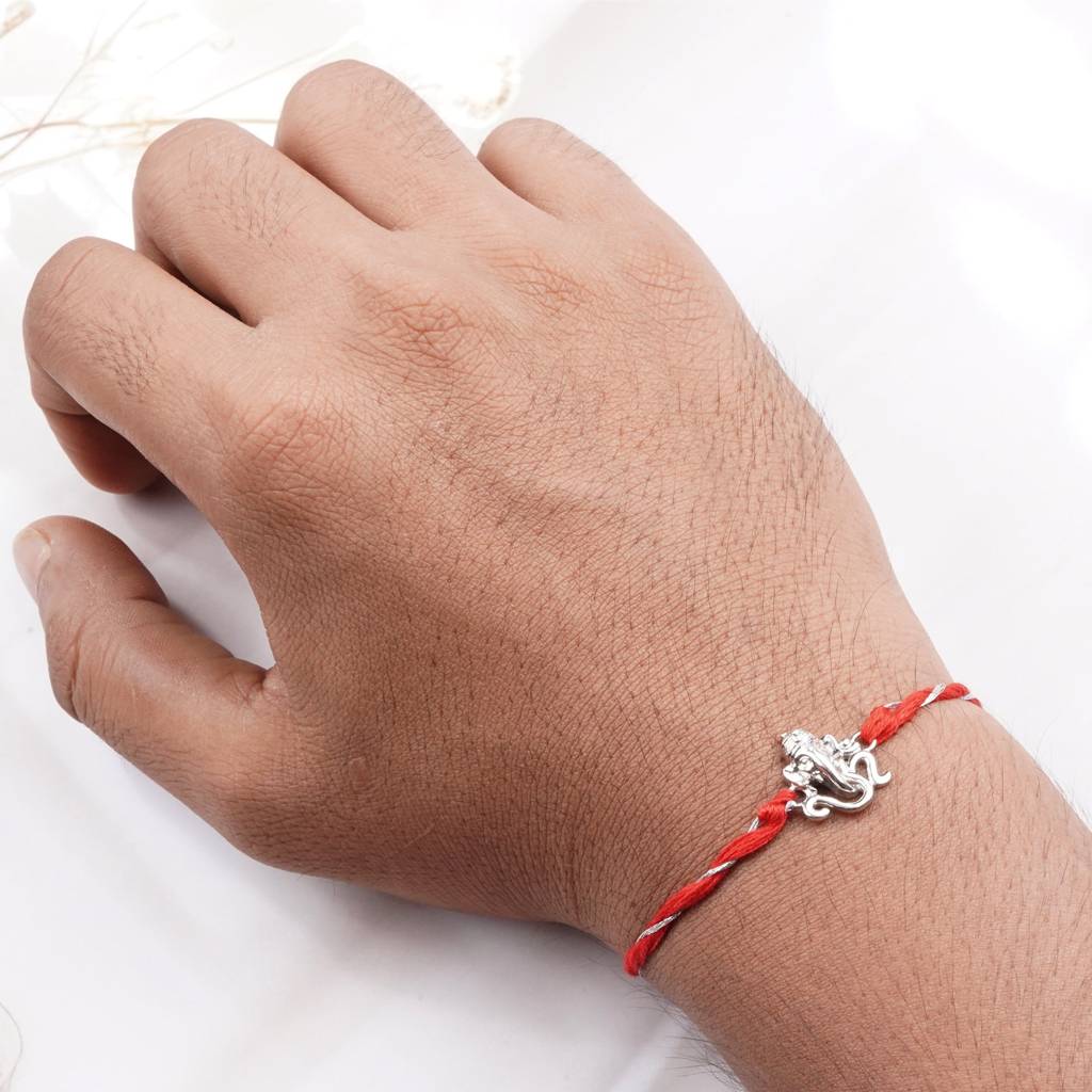 Silver Om Ganesh Face Rakhi : ZLRH-1017