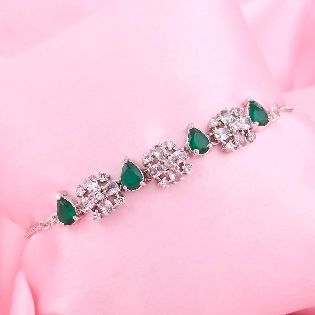 Estele Rhodium Plated Cz Sparkling Flower Designer Bracelet With Green Stones For Women