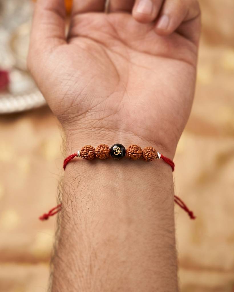 925 Silver Rakhi With Rudraksha And Aum Mani : IS-RK-ST-1013