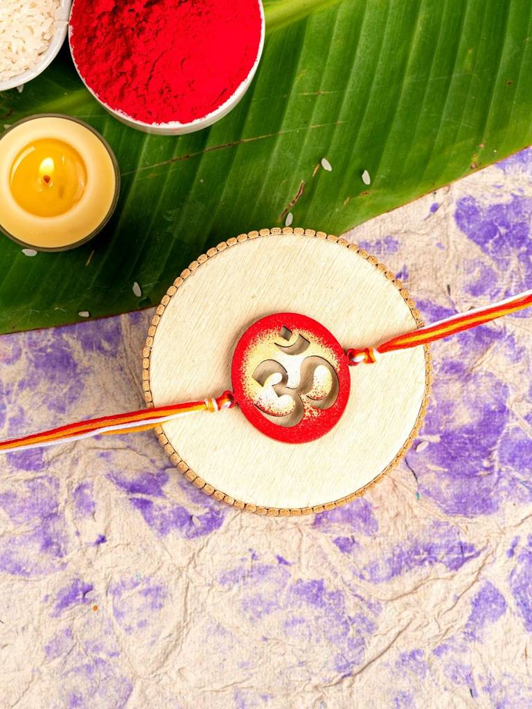 Eternz Certified Jewellery - Look and Adorn Handpainted Circular Red Om Designer Rakhi Set With Roli & Chawal