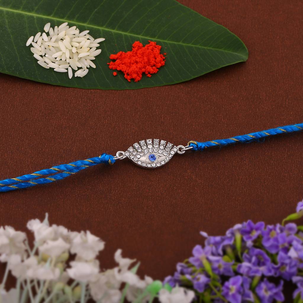 Estele Rhodium Plated Sacred Evil Eye Rakhi With Austrian Crystals & Enamel And Fancy Silk Thread : 131-IGRAKHI