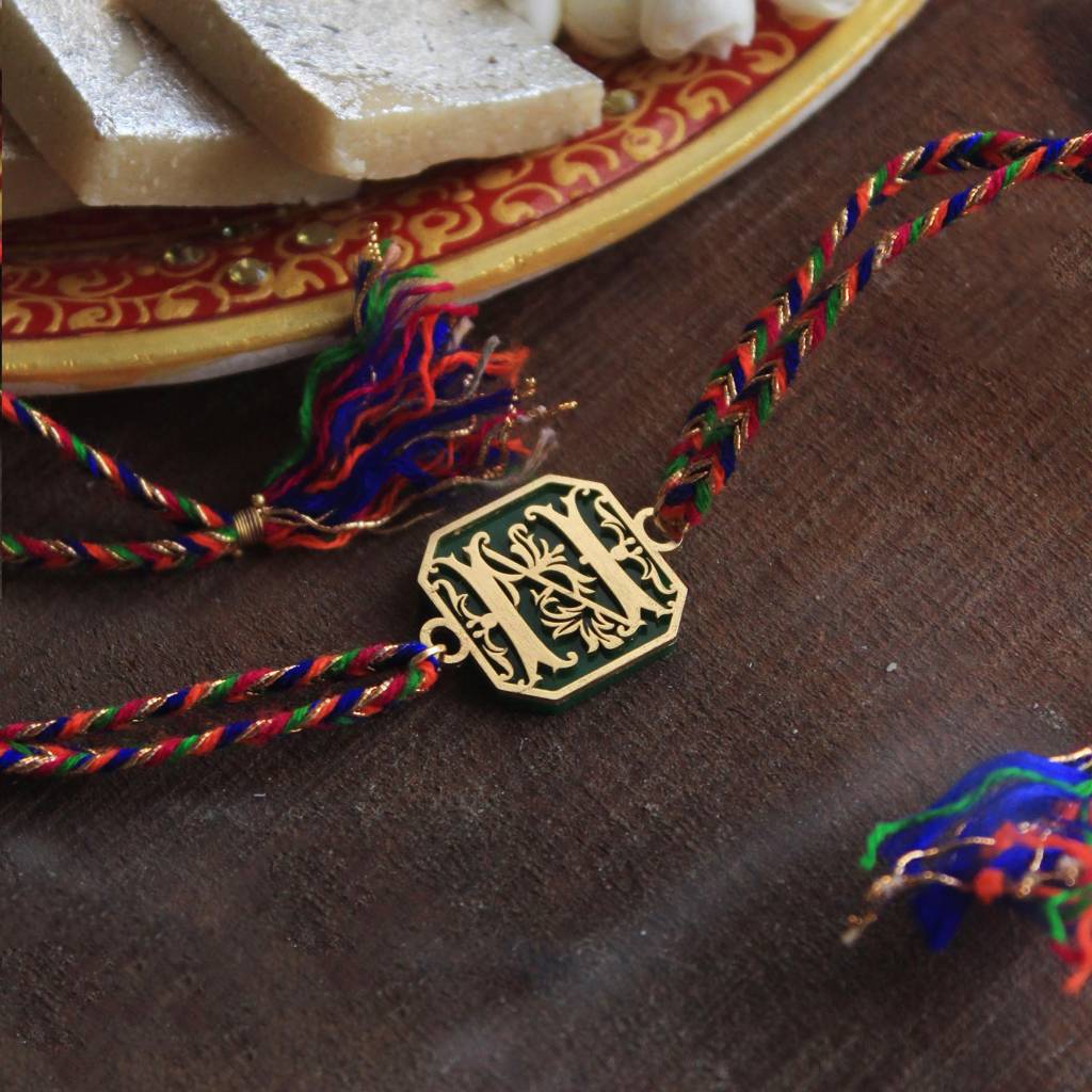 Green Floral Initial Acrylic Rakhi With Roli Chawal : ACJR061