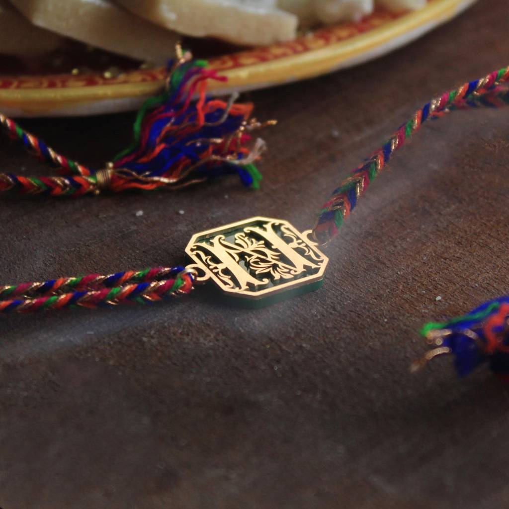 Green Floral Initial Acrylic Rakhi With Roli Chawal : ACJR061