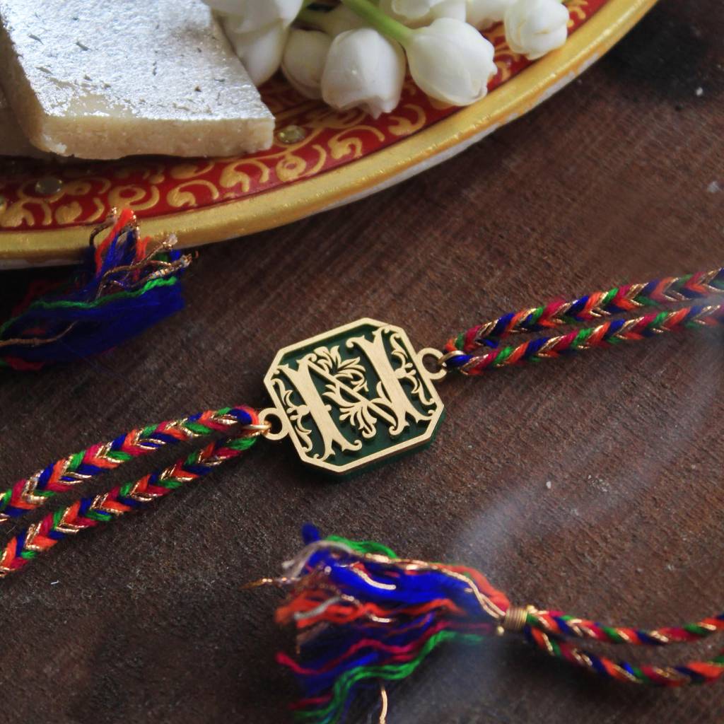 Green Floral Initial Acrylic Rakhi With Roli Chawal : ACJR061