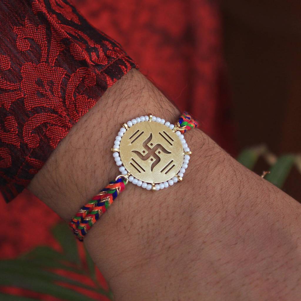 Golden Beaded Swastik Rakhi With Roli Chawal : ACJR063