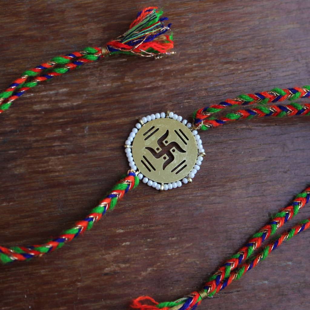 Golden Beaded Swastik Rakhi With Roli Chawal : ACJR063