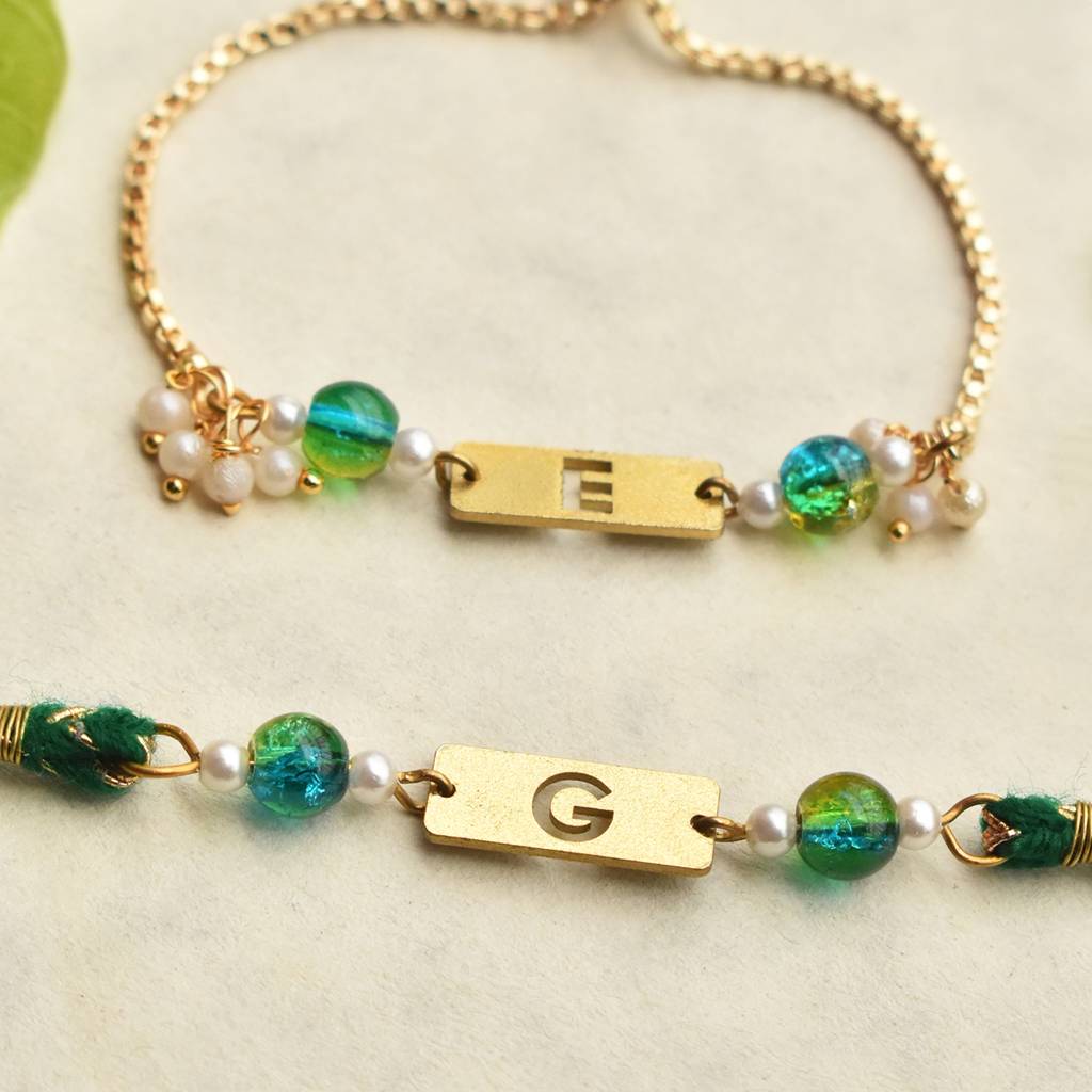Green Grace & Pearl Charm Personalised Rakhi-Lumba Set With Roli Chawal Capsules : ACRL076ACJR093