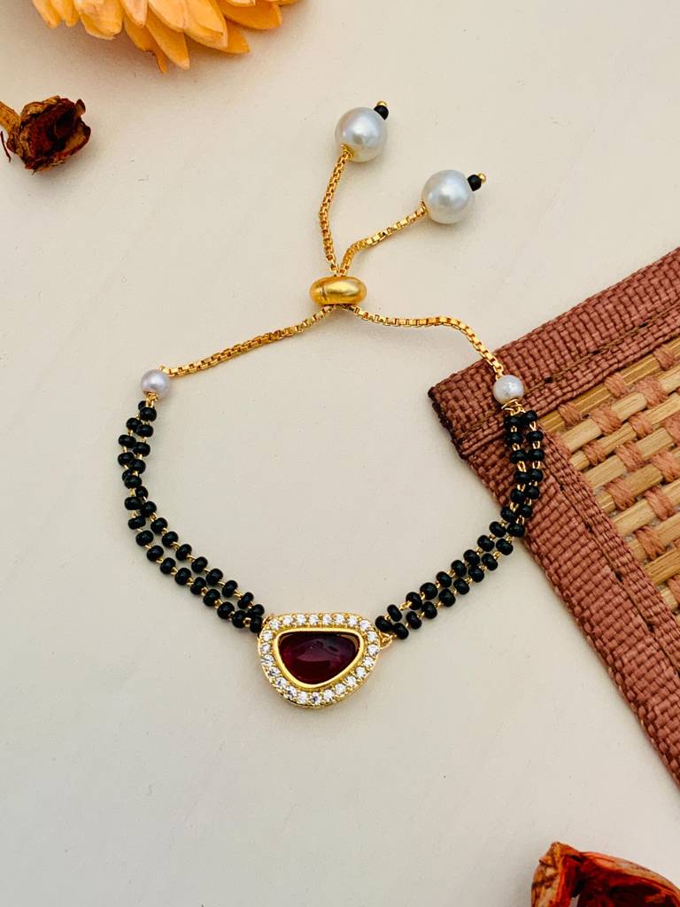 Pleasing Mother Pearl Red Gold Plated Hand Mangalsutra : GPHMMPBeanRed