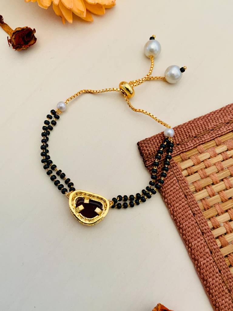 Pleasing Mother Pearl Red Gold Plated Hand Mangalsutra : GPHMMPBeanRed