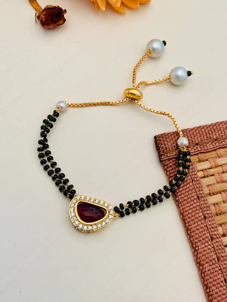 Pleasing Mother Pearl Red Gold Plated Hand Mangalsutra : GPHMMPBeanRed