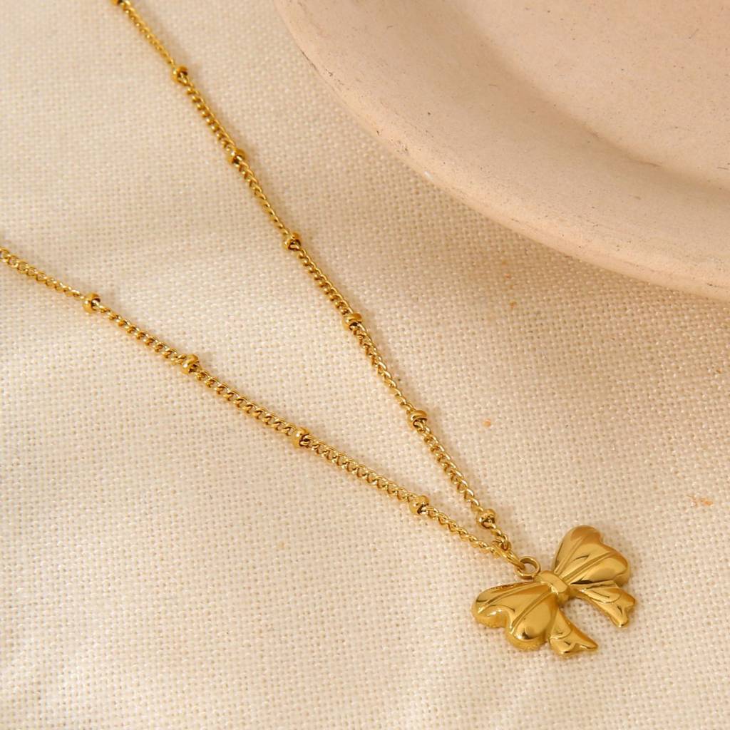 18K Gold Plated Waterproof Anti-Tarnish Ribbon Bow Pendant And Studs Set : ANX0125PS215C