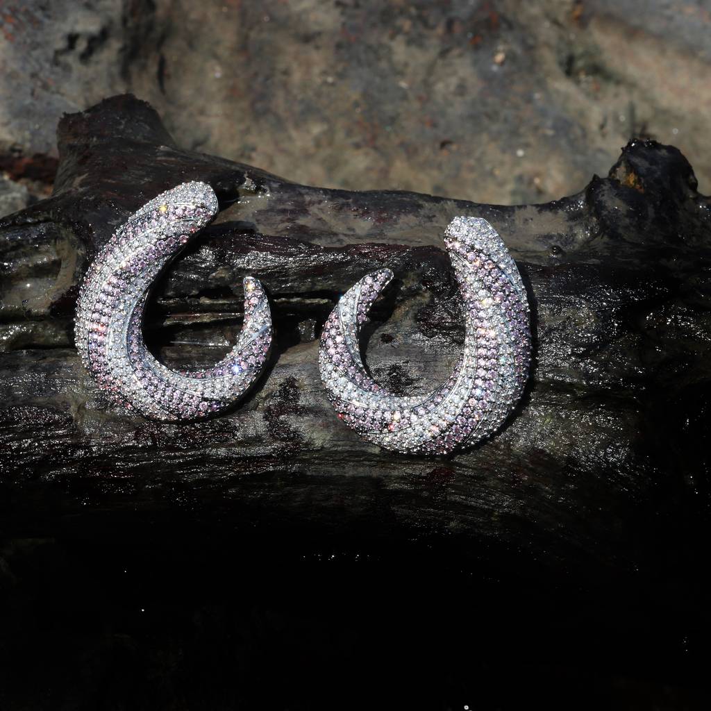 Closed Setting Lilac And Clear Cubic Zirconia Studs In An Interesting Swirl Design : RK-ER-ENN-530-PURPLE