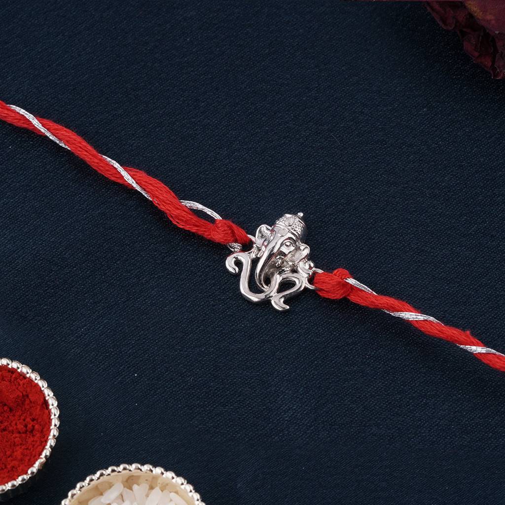 Silver Om Ganesh Face Rakhi : ZLRH-1017