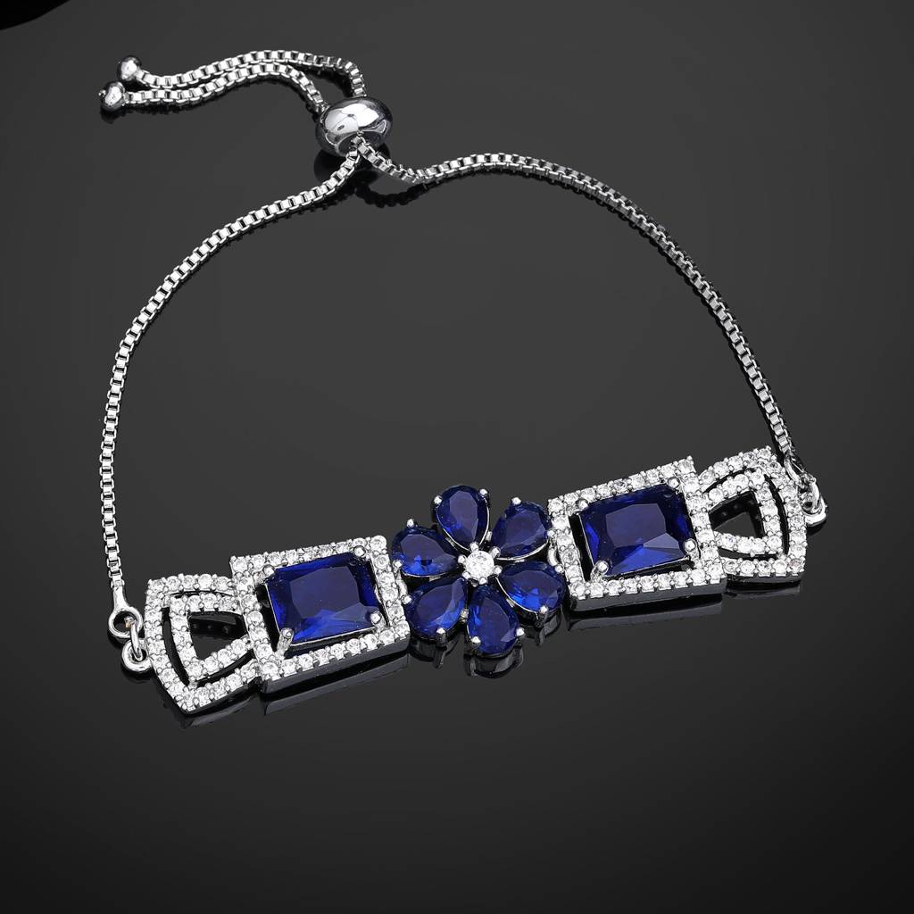 Estele Rhodium Plated Exquisite Floral Motif Enhanced Adjustable Charm Bracelet With Classic Blue American Dia : AD-068-IRBLBR