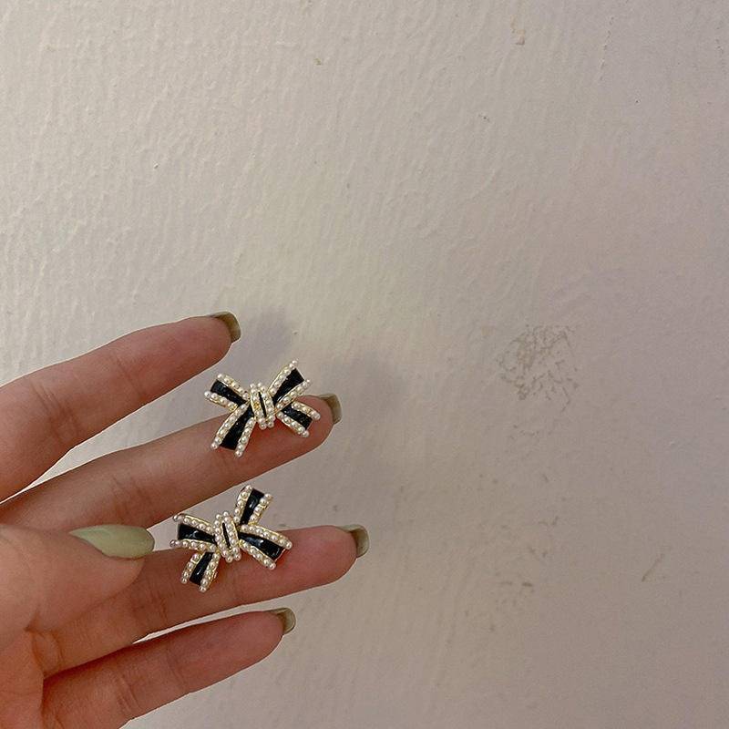 Black Cross Bow Statement Earrings For Women | Gold Plated Crystal Studded Designer Earrings | Bold Party Wear  : AST-EAR-0075