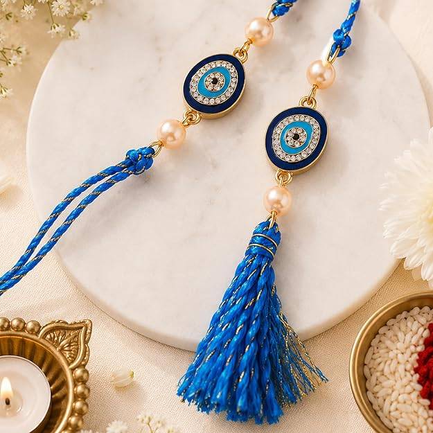 Eternz Certified Jewellery - Estele Gold Plated Sacred Evil Eye Bhaiya Bhabhi Rakhi Set With Fancy Silk Thread