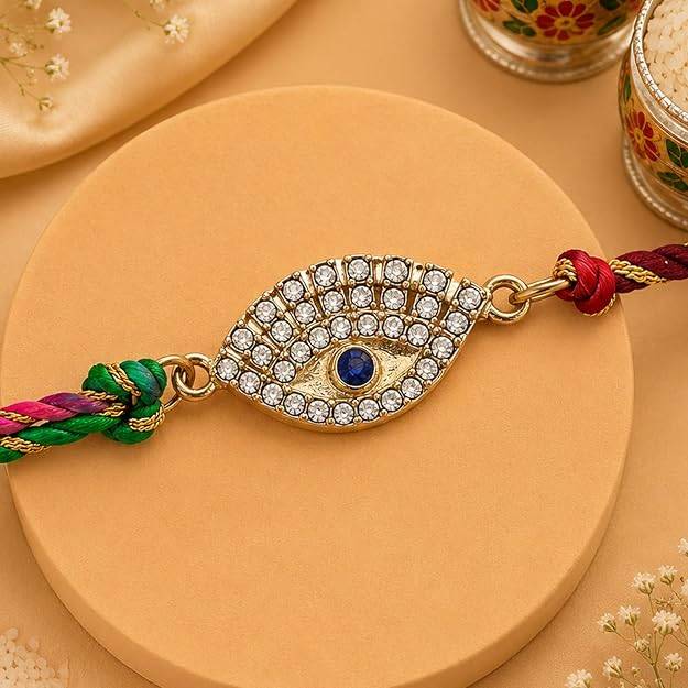 Eternz Certified Jewellery - Estele Gold Plated Sacred Evil Eye Rakhi With Austrian Crystals & Enamel And Multi Colored Silk Thread