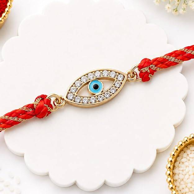 Eternz Certified Jewellery - Estele Gold Plated Auspicious Evil Eye Rakhi With Austrian Crystals And Multi Colored Silk Thread