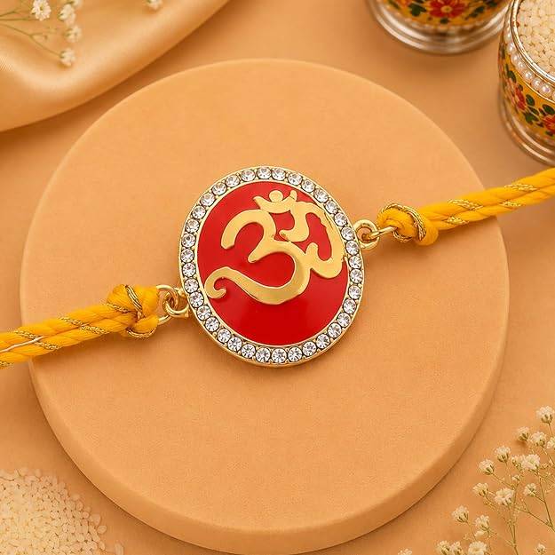 Eternz Certified Jewellery - Estele Gold Plated Eternal Om Rakhi With Red Enamel And Austrian Crystals & Fancy Silk Thread