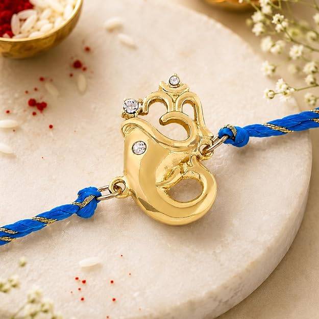 Gold Plated Blessed Ganesh Rakhi With Austrian Crystals And Fancy Silk Thread : 158-IG-RAKHI