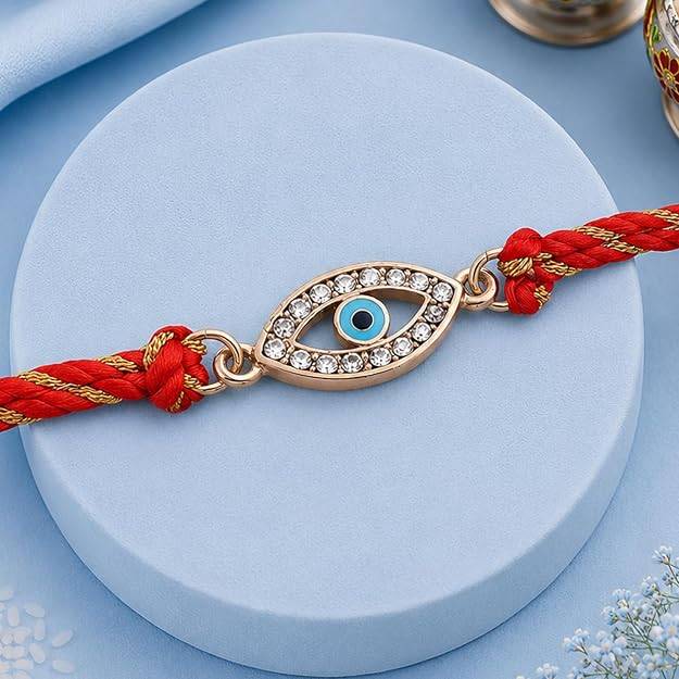 Gold Plated Auspicious Evil Eye Rakhi With Austrian Crystals And Multi Colored Silk Thread : 134-IG-RAKHI