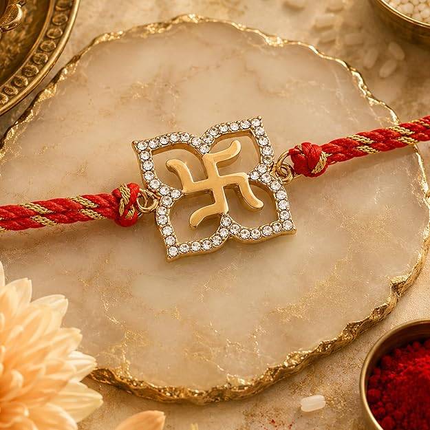 Gold Plated Holy Swastika Rakhi With Austrian Crystals And Divine Red Silk Thread : 169-IG-RAKHI
