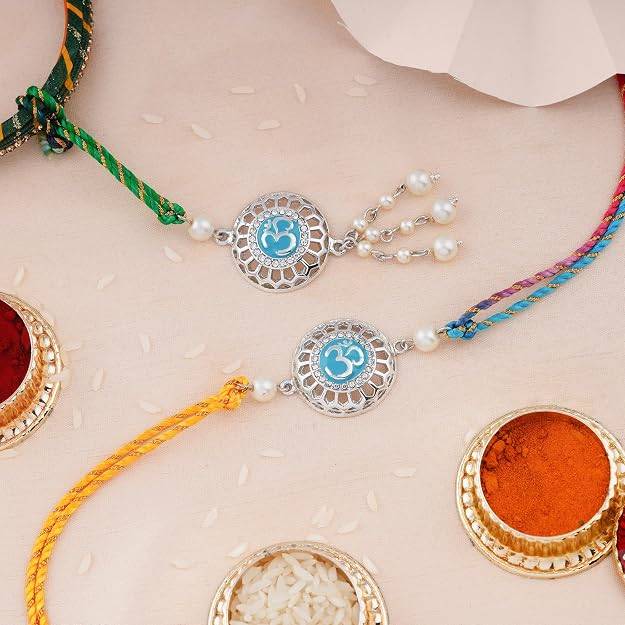 Rhodium Plated Auspicious Om Rakhi Set For Brother & Bhabhi With Silk Thread : 249-IR-RAKHI