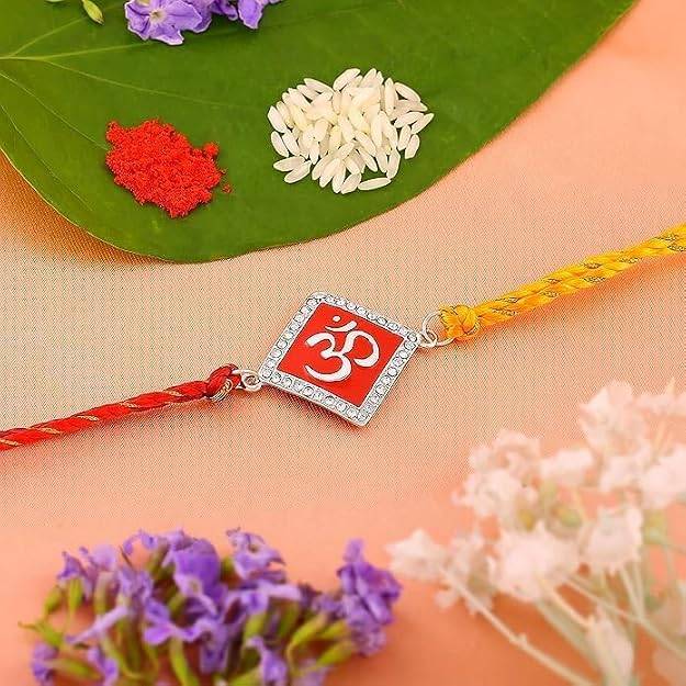 Rhodium Plated Divine Red Om Rakhi With Enamel & Austrian Crystals With Multi Colored Silk Thread : 171-IG-RAKHI