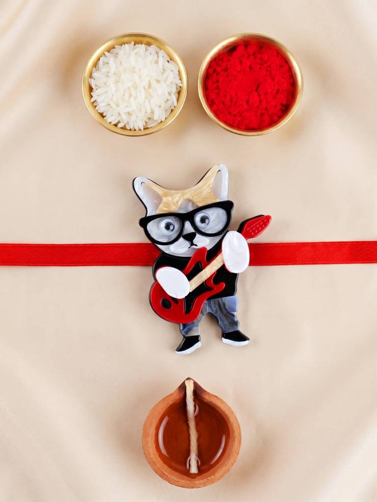 Kids Rakhi: Cute Rockstar Cat Playing Guitar Acrylic Charm On Red Ribbon, Roli, Chawal & Card (440-Chr1 : 440-CHR1-1192-1-2026