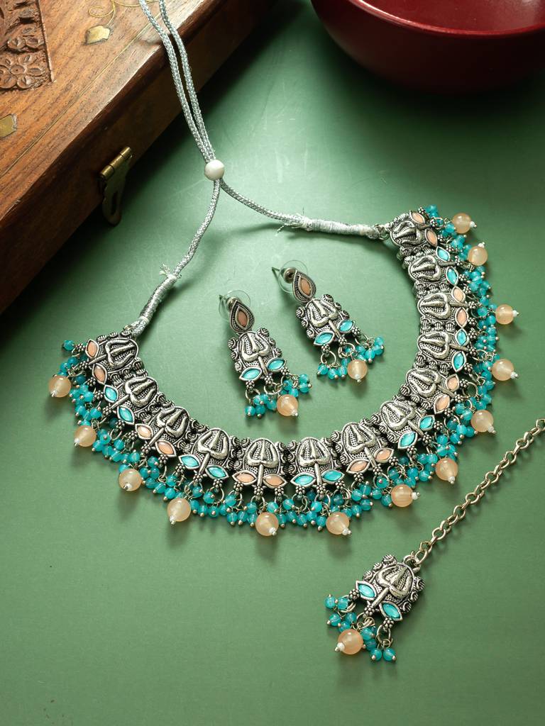 Navratri Special Silver Floral Choker Necklace Set With Earrings And Maang Tikka In Turquoise And Peach Beads : NK4099