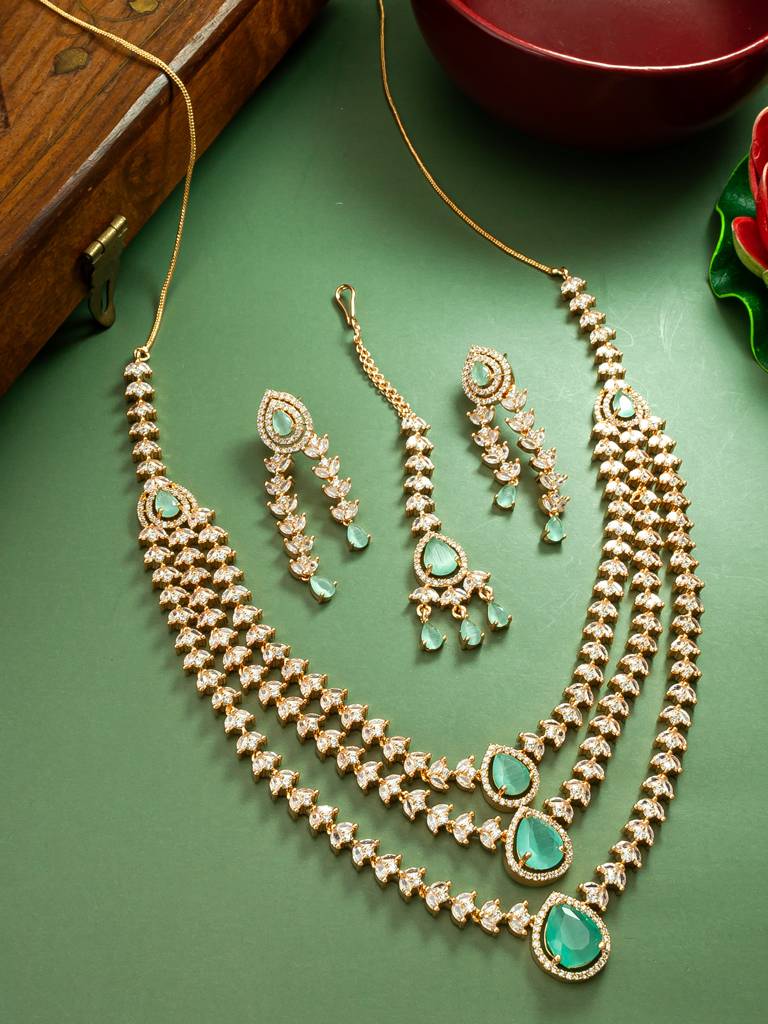 Rose Gold-Plated Ad Multi-Strand Necklace Set With Earrings And Maang Tikka In Mint Green And White Stones : NK4207
