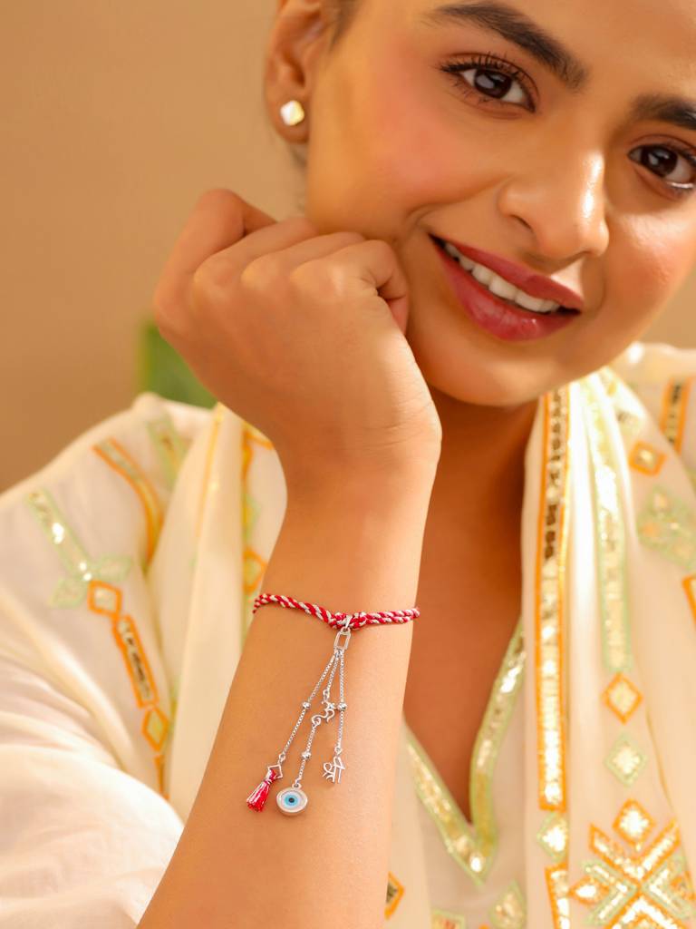 Kicky And Perky 925 Sterling Silver Om And Shree With Evil Eye Stone Lumba Rakhi For Bhabhi : SILRAK030