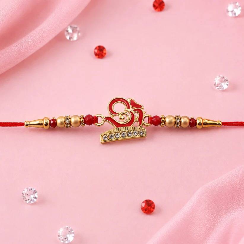 Stylized Peacock Feather Golden Swirl Rakhi For Raksha Bandhan : MRR-RAKHI-0027